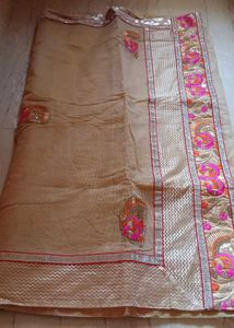 Elegant Beige colour Embroidered Saree