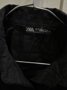 Sleeveless Black Button-Up Shirt