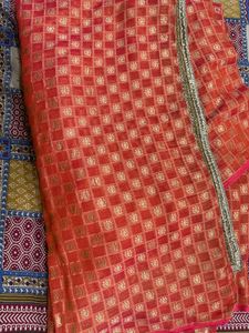 Beautiful Orange Saree with Gold Embellishments