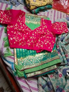 Embroidered Pink Blouse with Green Saree