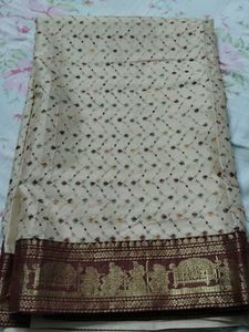 Elegant Cream Saree with Intricate Borders