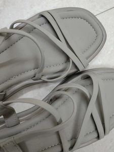 A khaki coloured women sandals