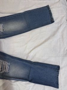 Distressed Blue Denim Jeans