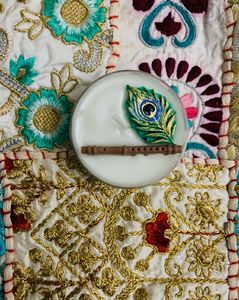 Decorative Candle with Flute &amp; Peacock Feather