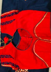 Elegant Blue Saree with Red Embroidery desig