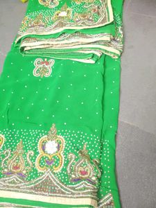 Vibrant Green Embroidered saree with stitched blou