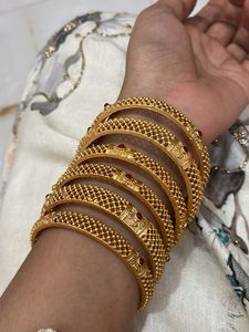 Set of 6 Gold Bangles with Red Stones