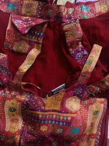 Red plazzo with stone work multi colour top