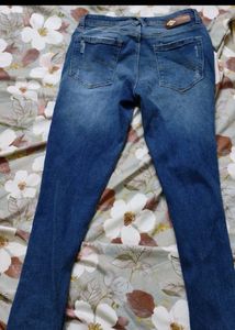 Distressed Blue Denim Jeans