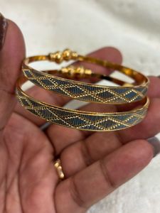 Elegant Gold Bangles with Intricate Design