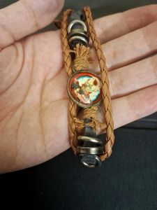 Vintage wristband with ironman charm