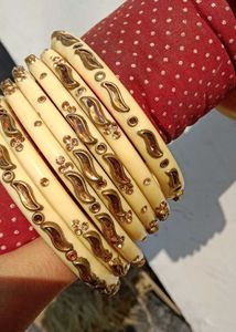 Elegant Cream Bangles with Gold Embellishments
