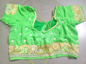 Vibrant Green Embroidered saree with stitched blou