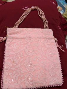 pink embroiderd party  potli bag absolutely new