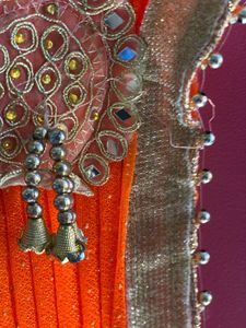 Stunning Blue and orange Net saree with Embellishm