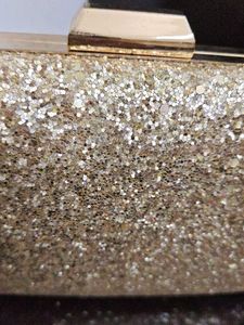 styling and charming gold clutch