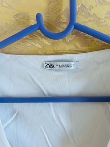 White Peplum Long Sleeve Top