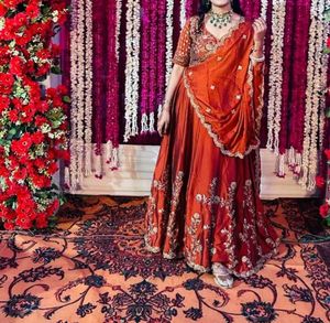 Elegant Orange Embroidered Lehenga Choli