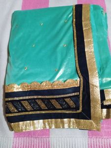Stunning Teal Saree with Gold Border