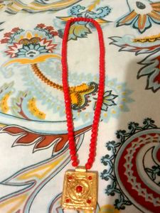 Red Beaded Necklace with Gold Pendant
