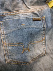 Distressed Blue Denim Jeans