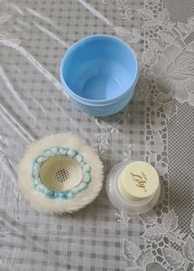Baby powder puff with a refill container