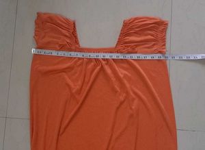 Elegant Orange Gown with Smocked Neckline