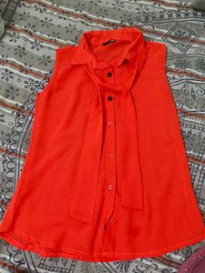 Vibrant Red Sleeveless Button-Up Top