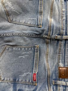 Ripped Light Wash Denim Jeans