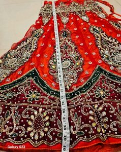 Red Wedding lehanga with stud work on Dupatta