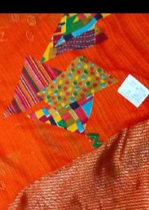 Vibrant Orange Saree with Colorful Motifs