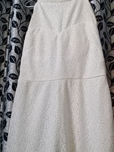 Fish tail gown with round neck.