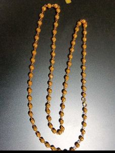 Elegant Gold Beaded Necklace with Swastik