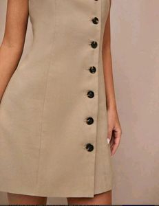 beige sleeveless A-line mini dress
