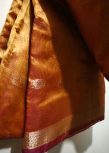 Elegant Orange Saree with Intricate Border