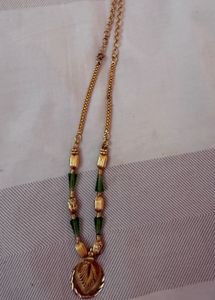 Elegant Gold Necklace with Green Beads