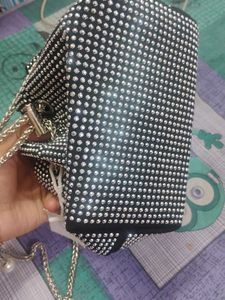 new sling potli bag black and silver in coulour...