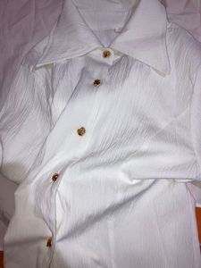 white shirt with gold button details