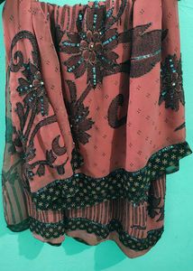 Elegant Coral Saree with Black Floral Print