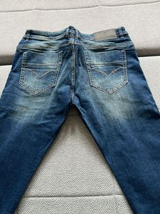Distressed Blue Denim Jeans