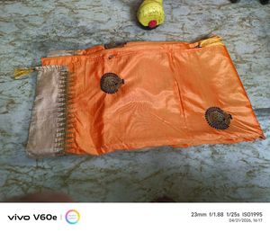 Vibrant Orange Saree with Golden Border