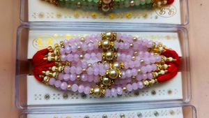 Elegant Red Beaded Rakhi 12 pc Set
