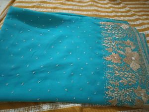 Turquoise Saree with Gold Embellishments