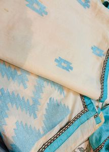 Cream Saree with Blue Embroidery blouse