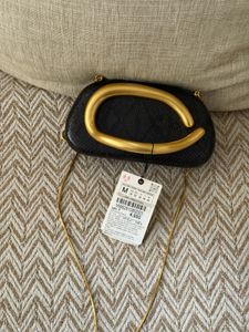 Zara Black textured Clutch with Gold Accent