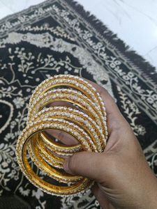 Elegant Gold and Pearl Bangles