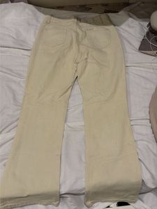 Cream Distressed Flare Jeans