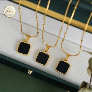 Elegant Gold Chain with Black Pendant