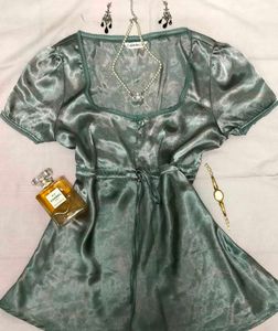 Silky teal fey top with lace trim