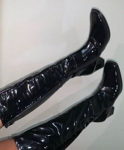 Knee length glossy boots